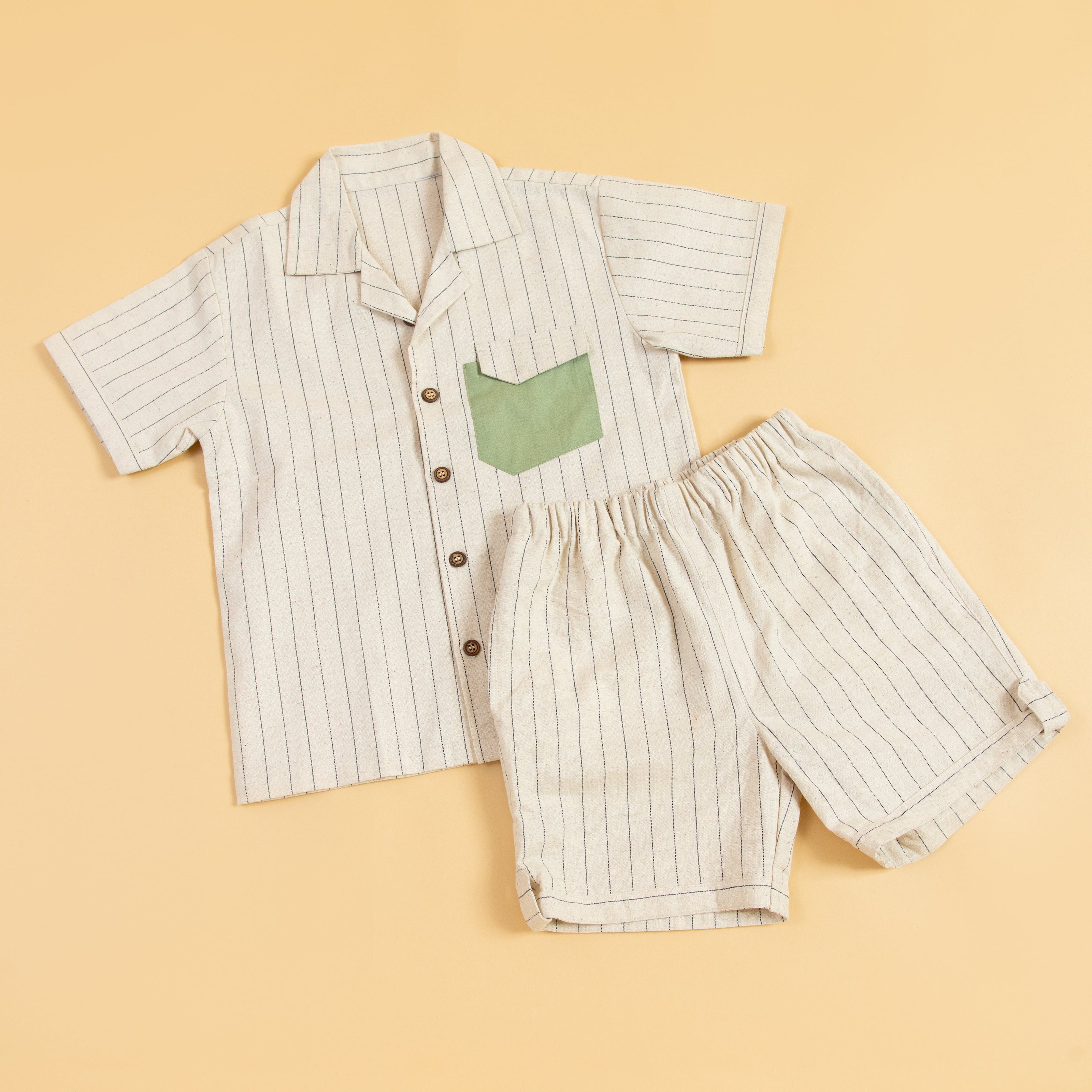 Striped casual two piece outfit featuring a short-sleeve shirt and matching shorts with a green pocket