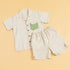 Striped casual two piece outfit featuring a short-sleeve shirt and matching shorts with a green pocket