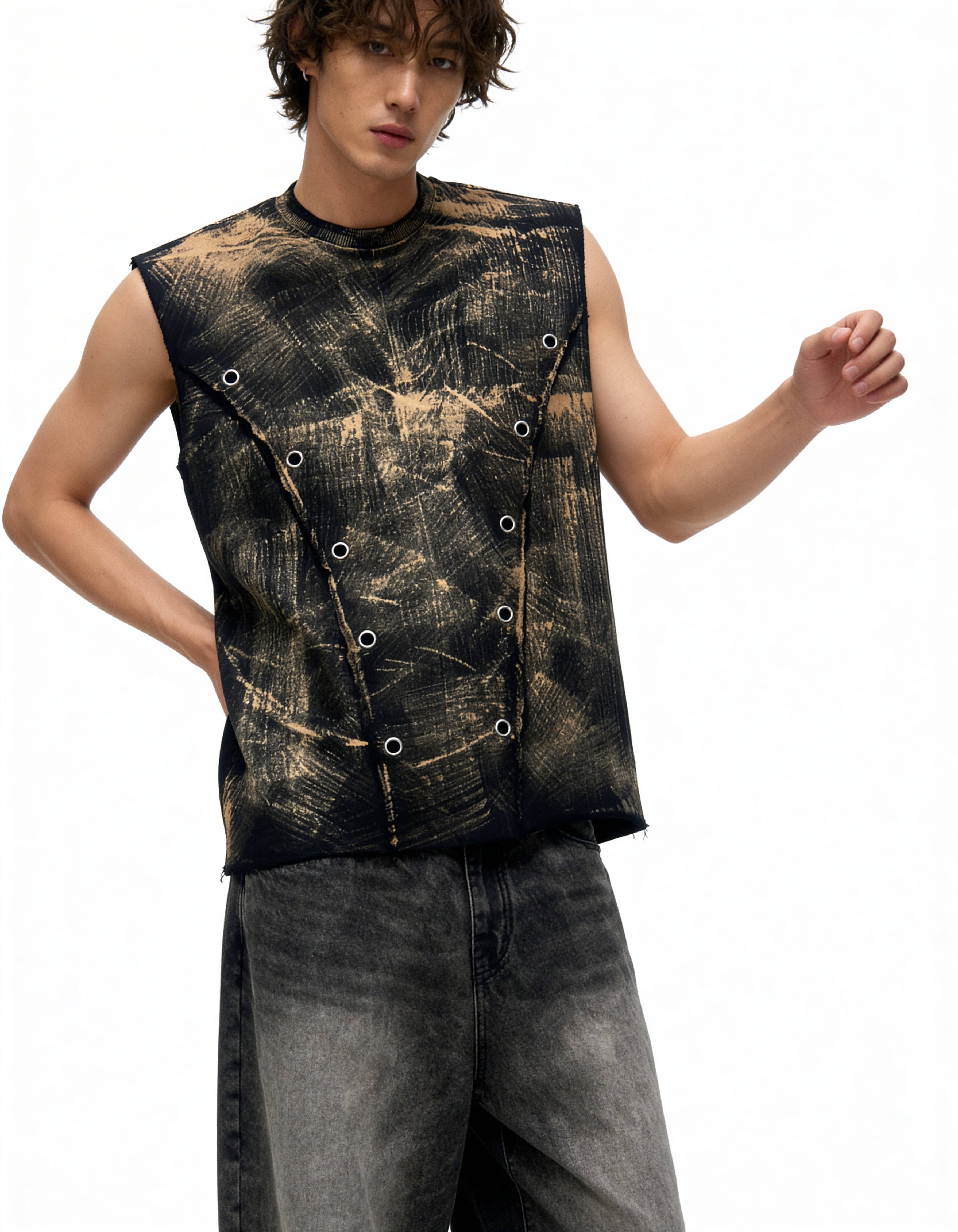 Person wearing a sleeveless, patterned top with a white background