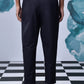 Back view of stylish black pants for work by Stylera worn with black shoes