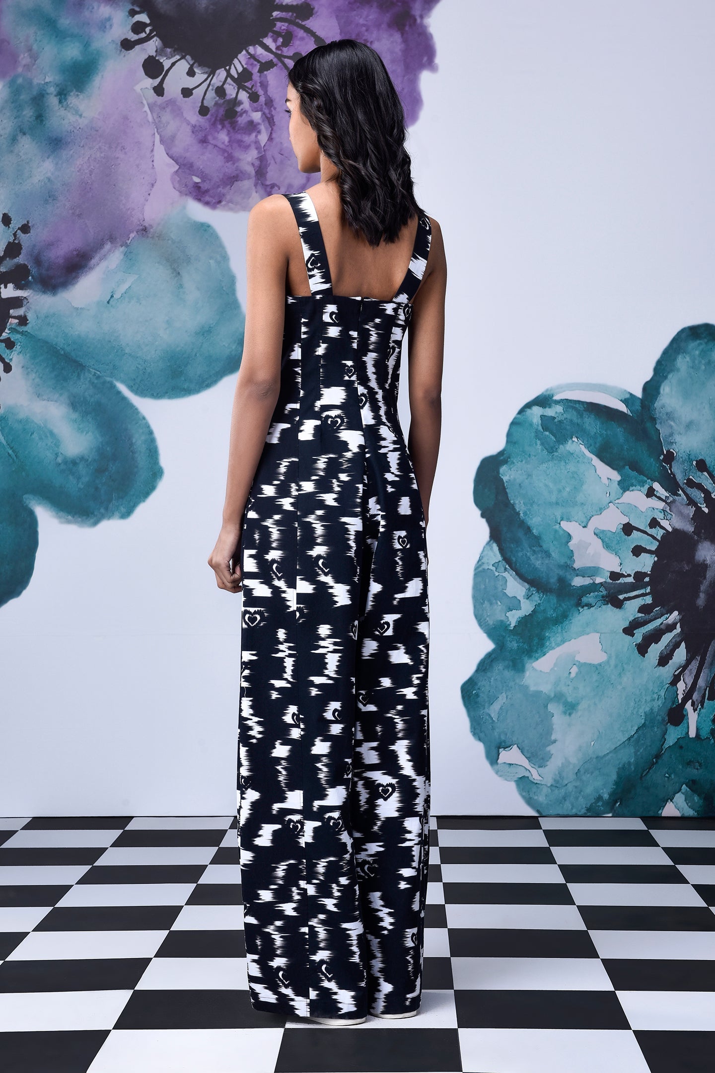 Back view of Stylera black and white patterned long dungaree with wide straps stylish casual dungarees for women