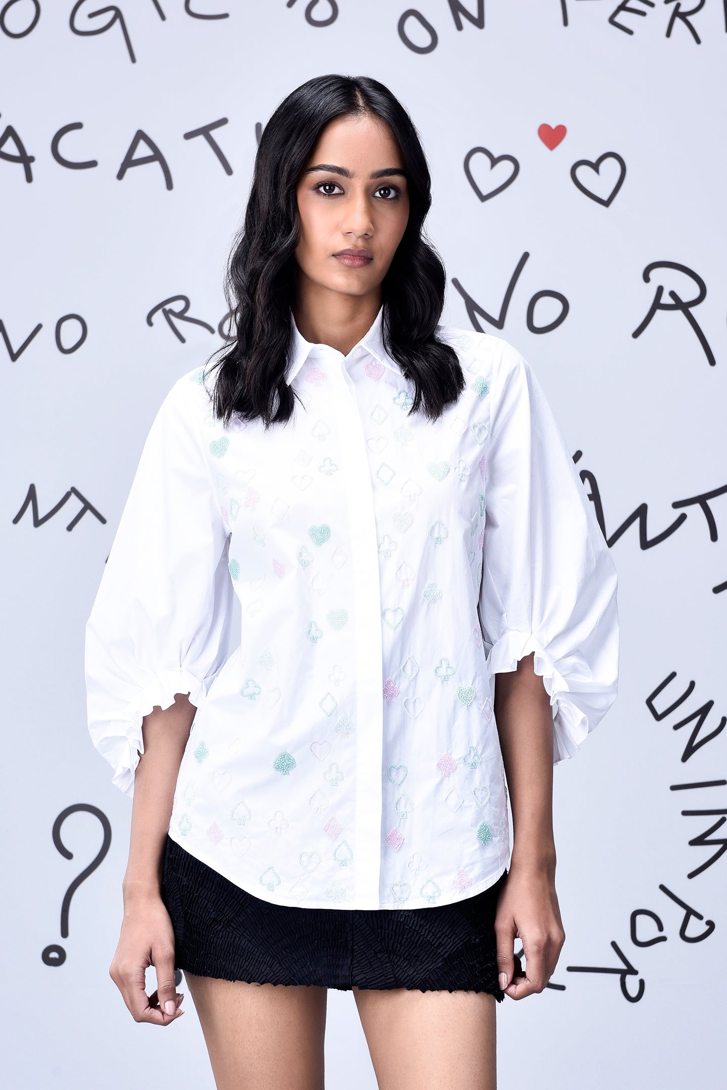 Model wearing Stylera white button down stylish casual embroidered top with puff sleeves and collar