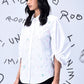 Model wearing Stylera stylish casual embroidered top white button down with puff sleeves