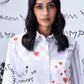 Stylera white button down shirt with red heart print and handwritten text on model stylish casual shirts for women