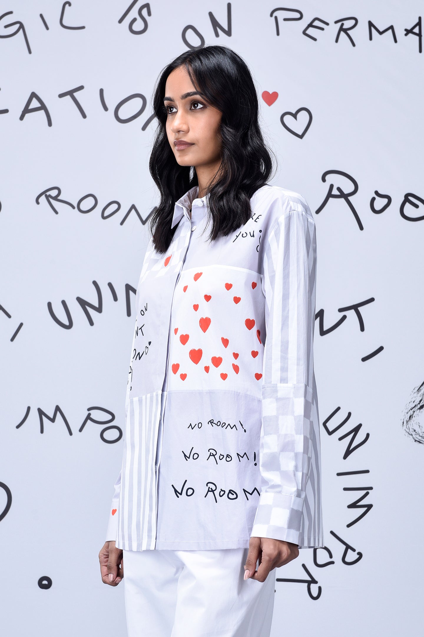 Stylera white button shirt with red heart print and handwritten script on model stylish casual shirts for women