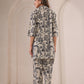 Back view of a stylish co-ord outfit for women featuring artistic face prints by Stylera