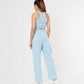 Back view of a model wearing stylish co ord sets for women in light blue, featuring a cropped tank and wide-leg pants.