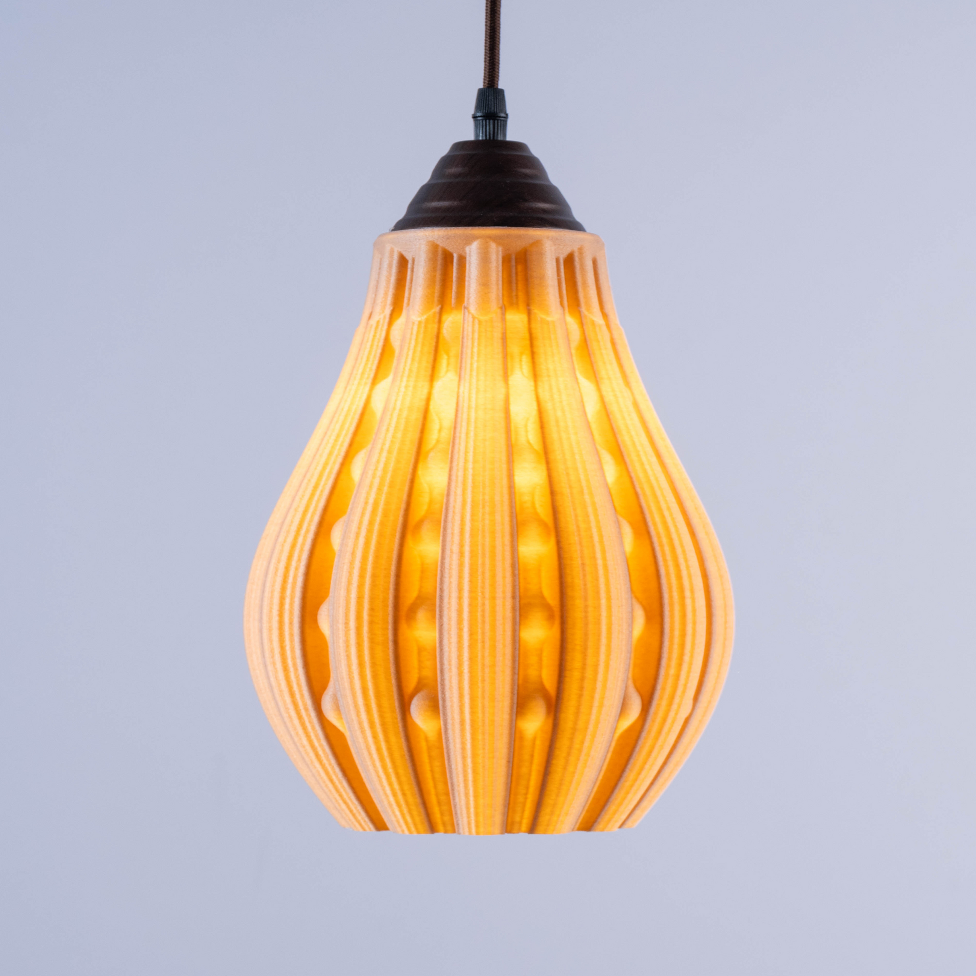 Sozori stylish decorative hanging lamp with a unique ribbed design and warm glow for modern interiors