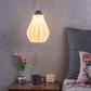 Sozori stylish decorative hanging lamp illuminating a cozy bedroom with flowers and candles