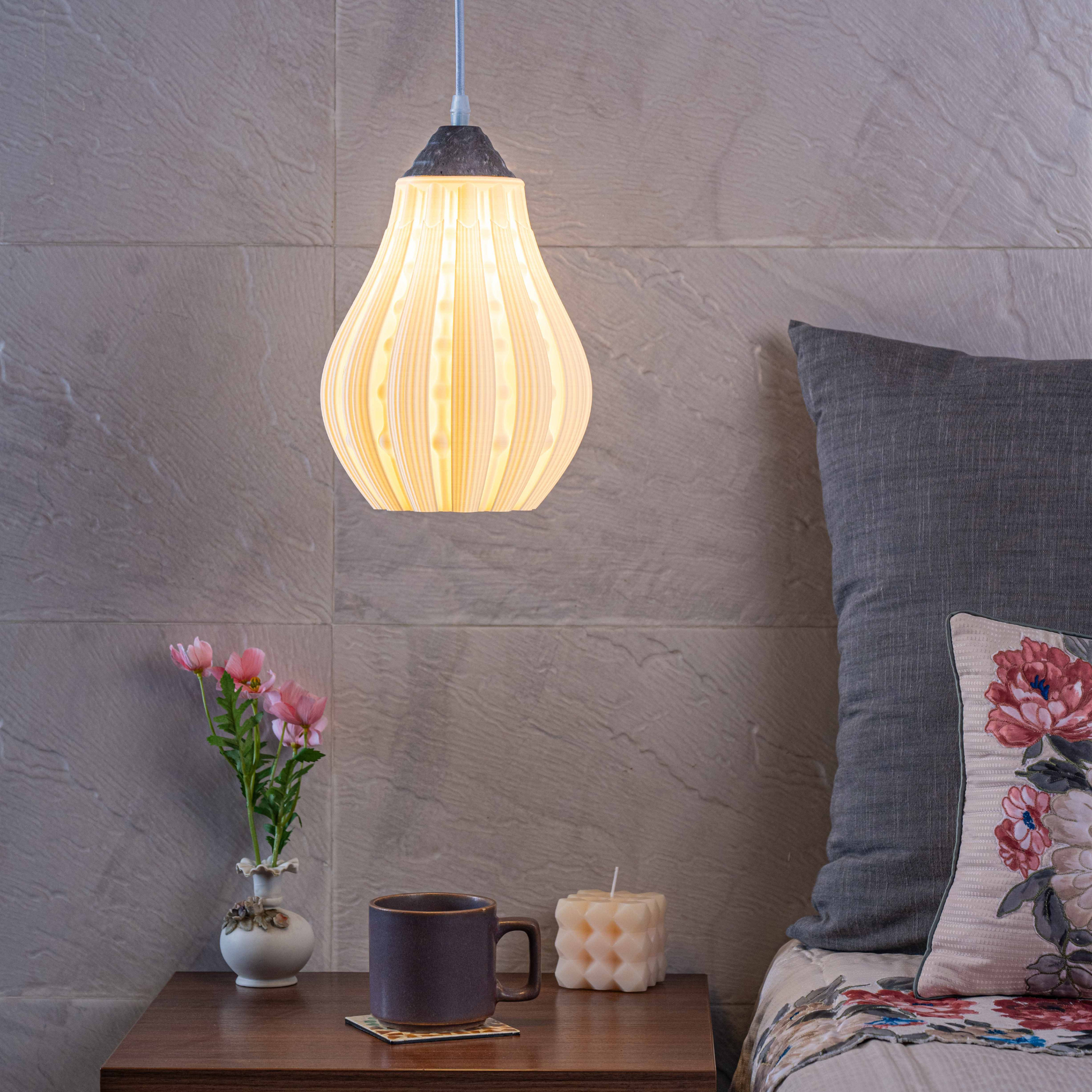 Sozori stylish decorative hanging lamp illuminating a cozy bedroom with flowers and candles