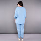 Back view of a stylish denim track suit in light blue by Stylera, featuring relaxed fit and comfortable fabric