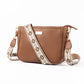 Stylish everyday sling bag in brown with decorative strap for daily use and versatility