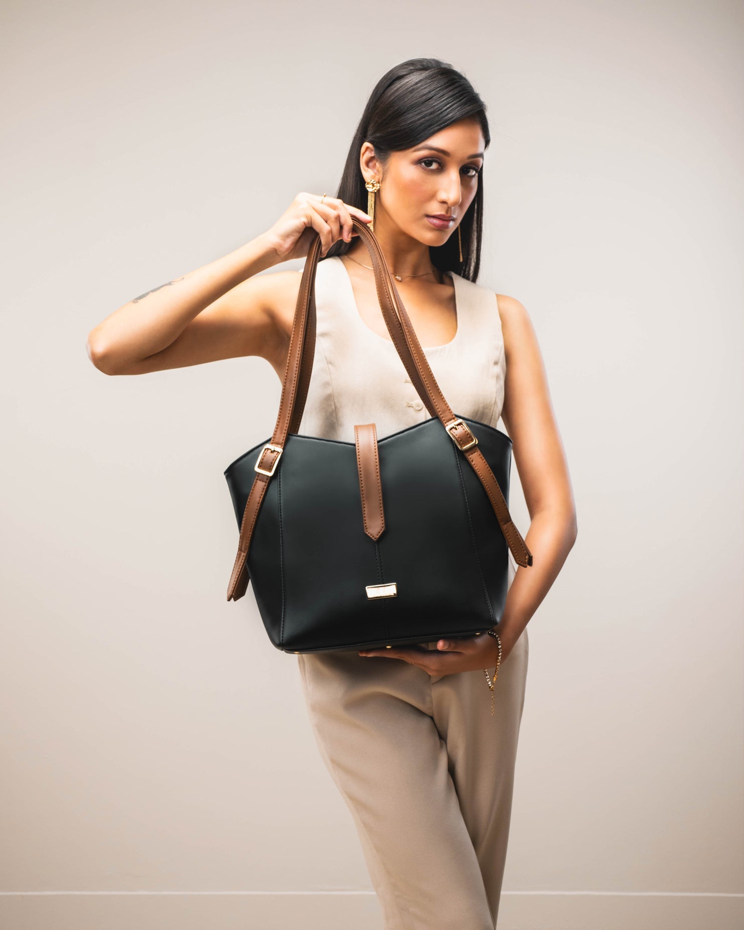 Elara Tote Bag by Stylera, a stylish everyday tote purse in black with brown straps