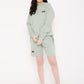 Stylera sage green sweatshirt and shorts on model with white sneakers stylish graphic sweatshirts for camping