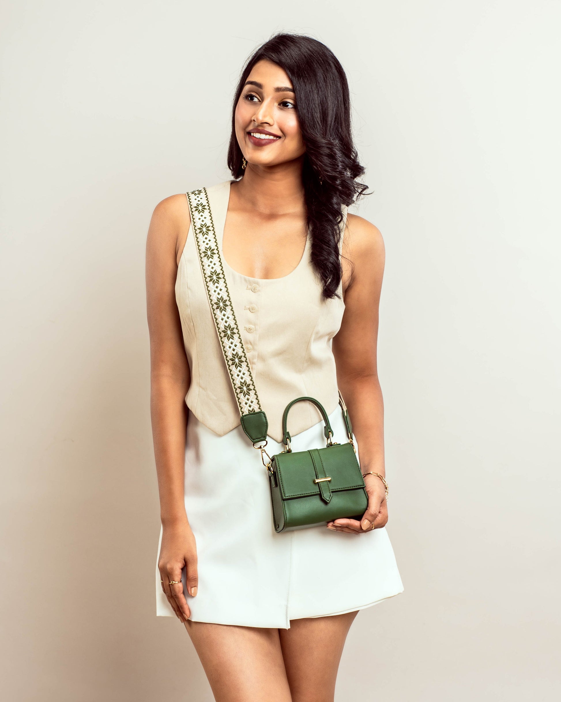 Stylish green purse with gold chain showcased on a model for a trendy look