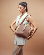 Chic model showcasing stylish large everyday tote bag in brown and beige for versatile use