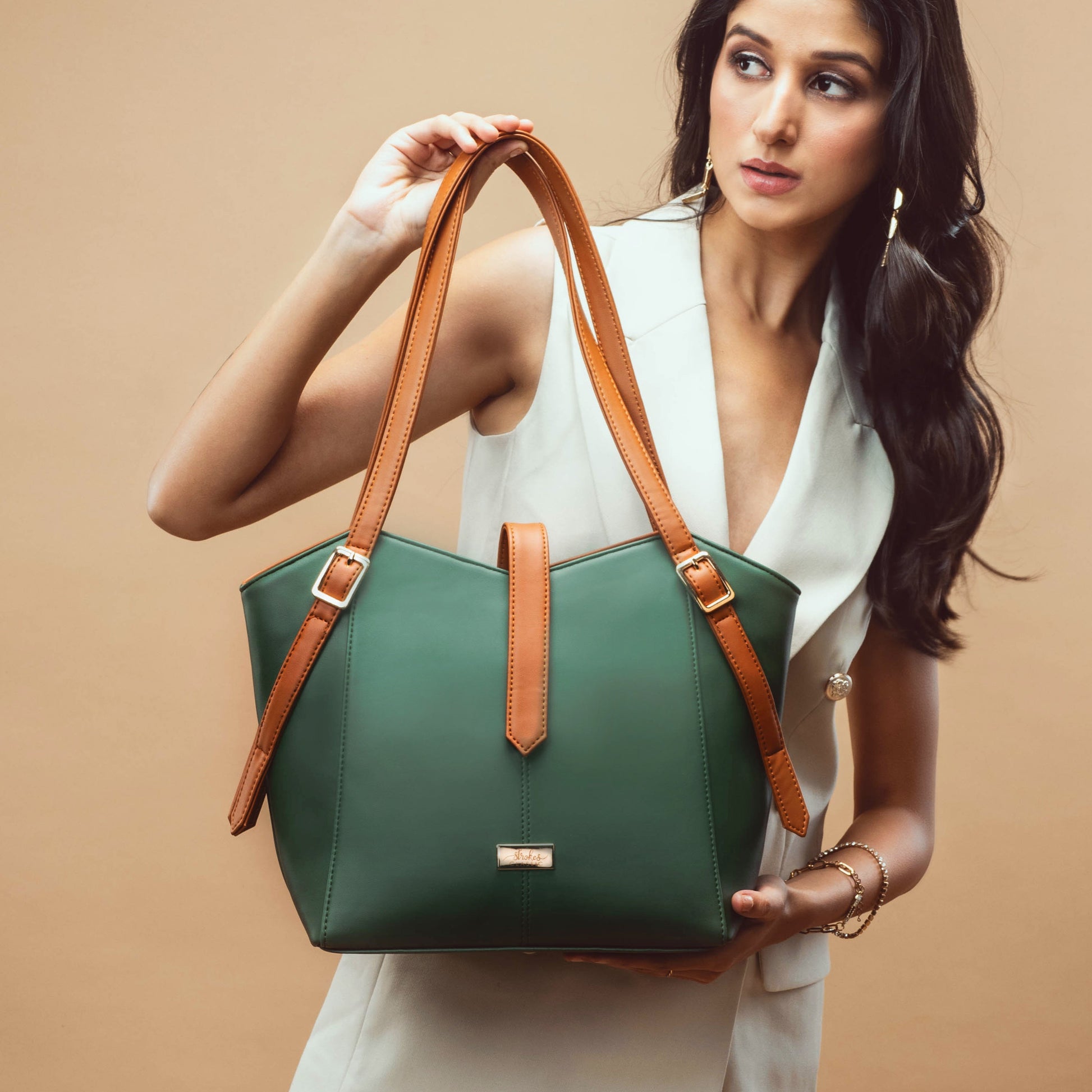 Stylish leather tote for women in green and tan with spacious design and elegant styling