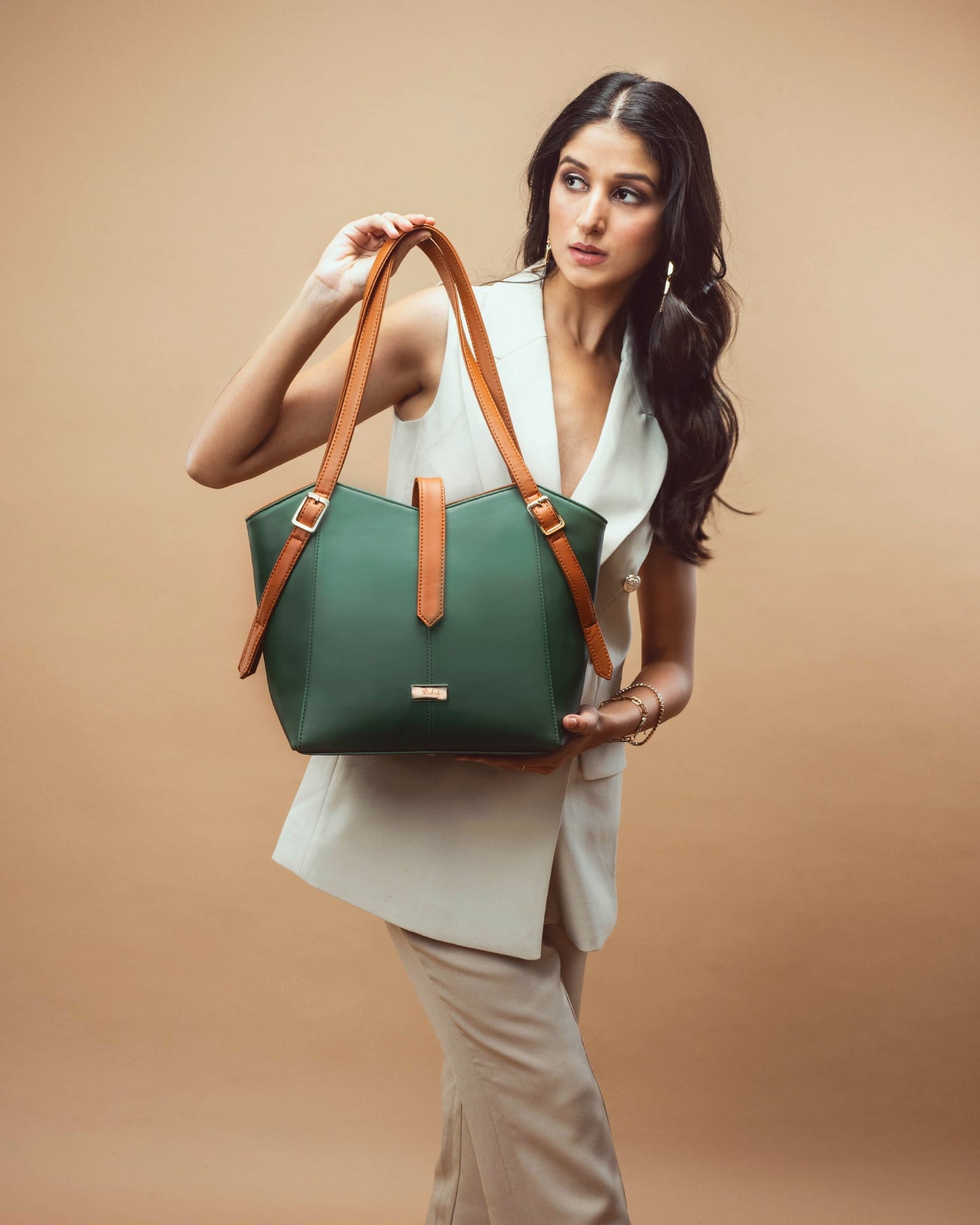 Model holding a stylish leather tote for women by Stylera, showcasing its elegant design