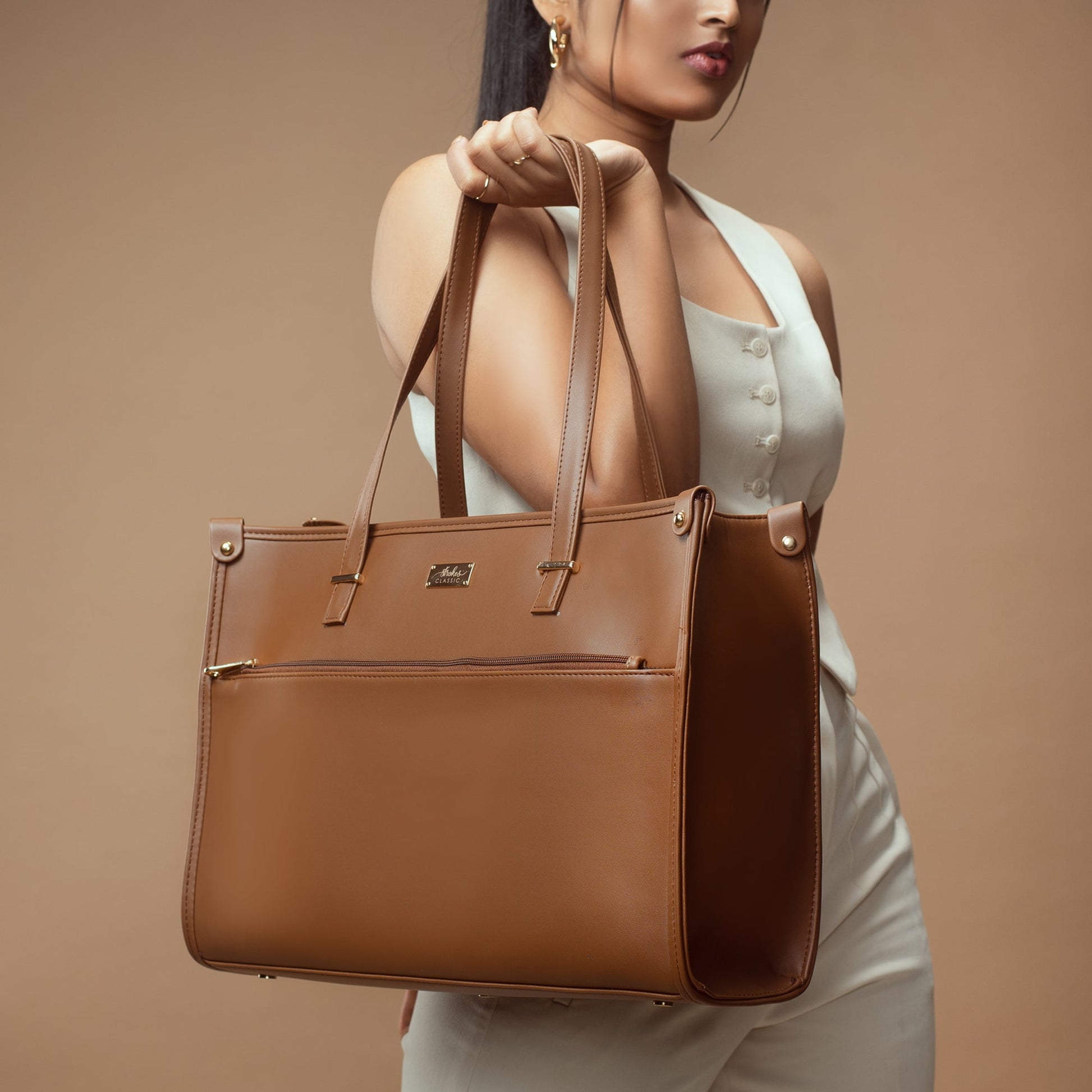 Stylish office tote bag in rich brown color with multiple compartments and durable handles