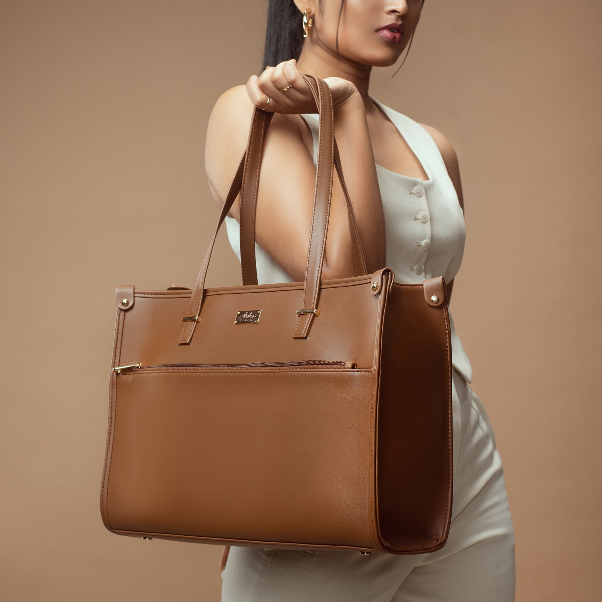 Stylish office tote bag in rich brown color with multiple compartments and durable handles