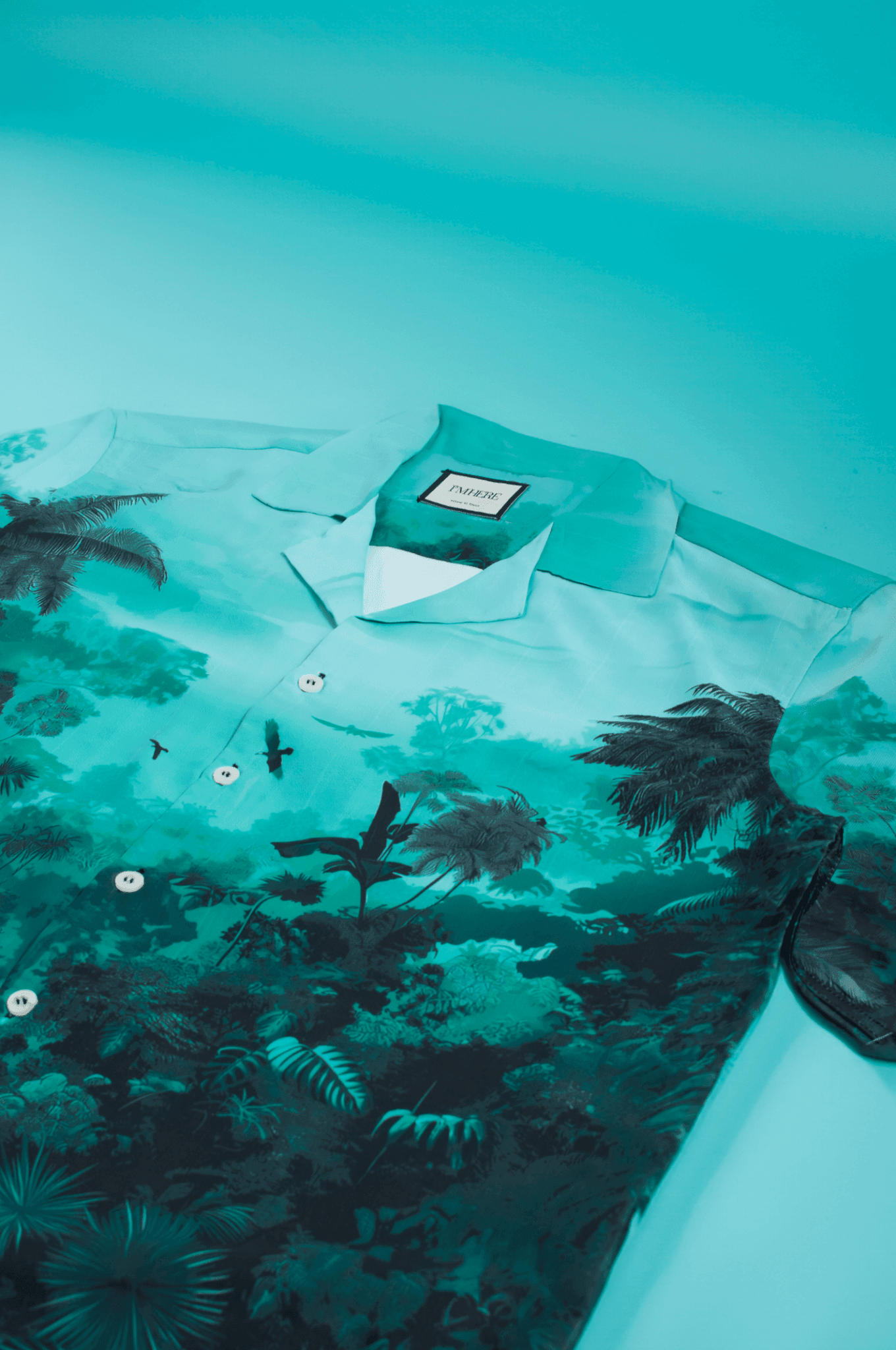 Stylera teal tropical print stylish short sleeve resort shirt with camp collar buttons and palm foliage design