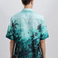 Back view of model wearing Stylera teal palm print stylish short sleeve resort shirt with relaxed fit