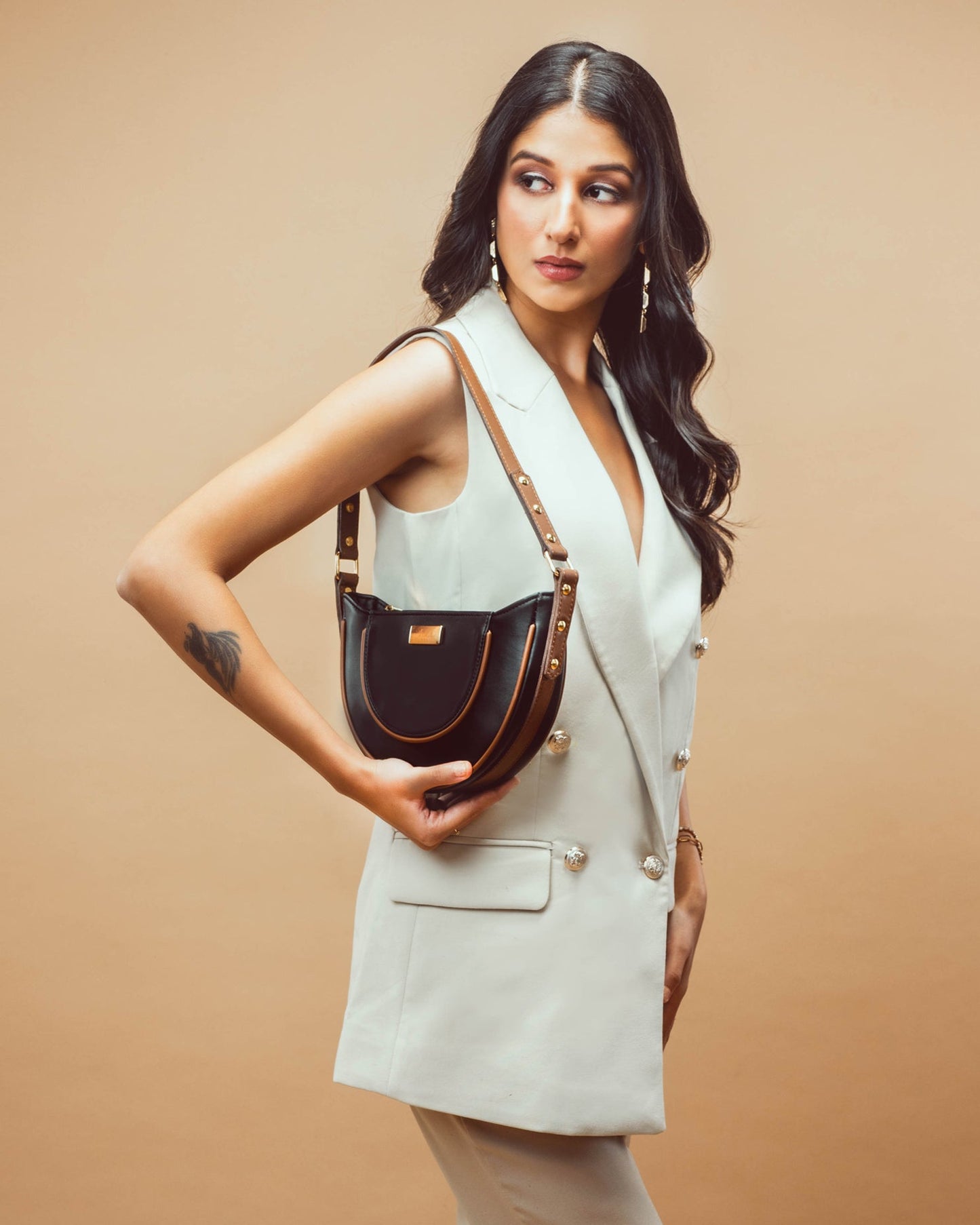 Stylera stylish shoulder bag for women in a chic outfit against a neutral background