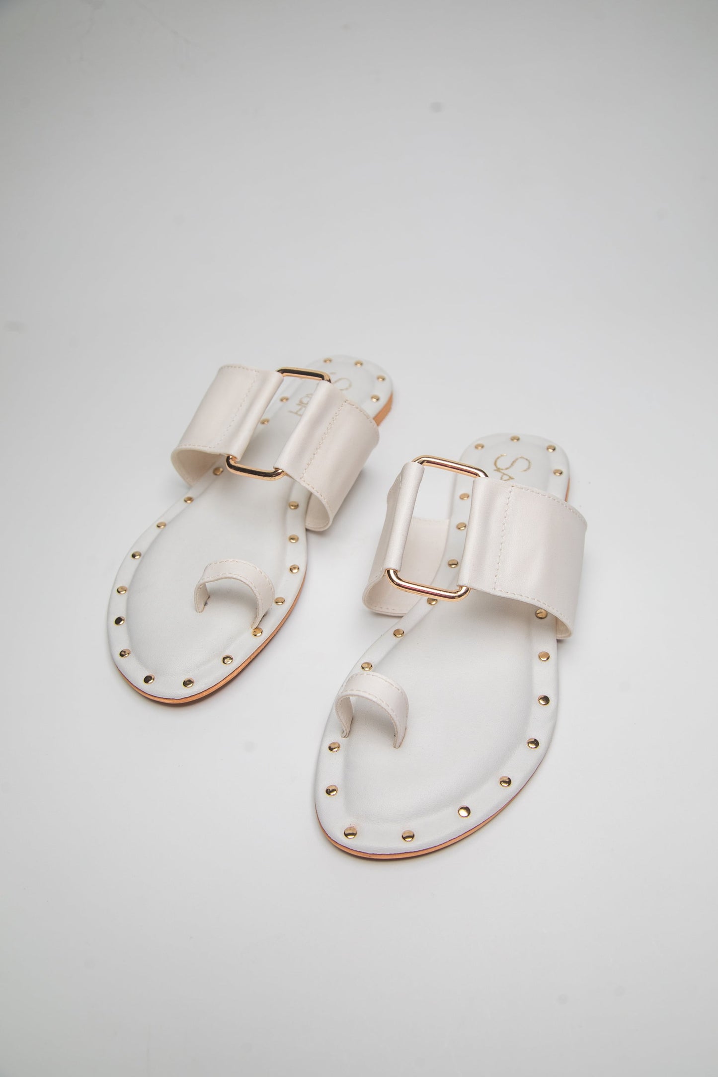 Stylera stylish summer slip on flats in white with gold buckle and stud details
