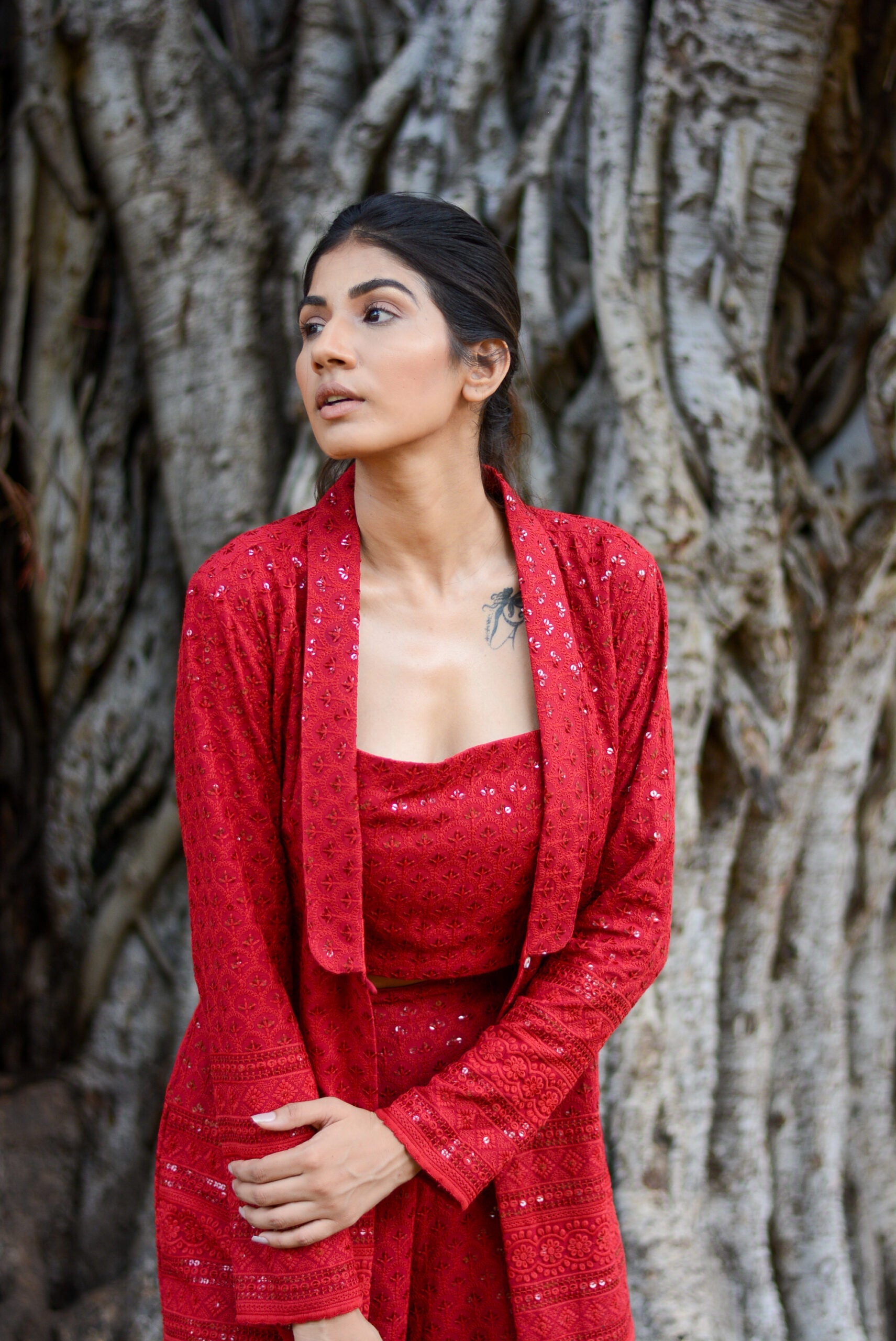 Elegant red ensemble featuring a stylish three piece set for parties, perfect for special occasions.
