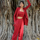 stylish three piece set for parties featuring a red crop top and tailored pants with a matching jacket
