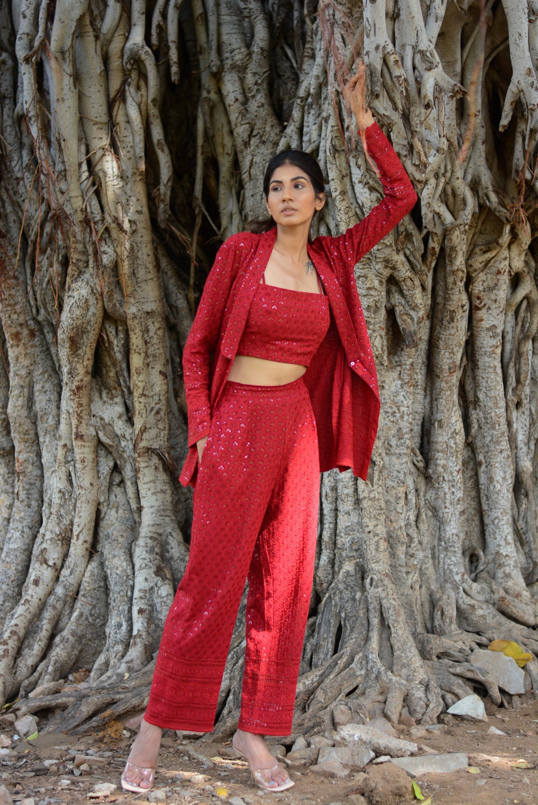 stylish three piece set for parties featuring a red crop top and tailored pants with a matching jacket