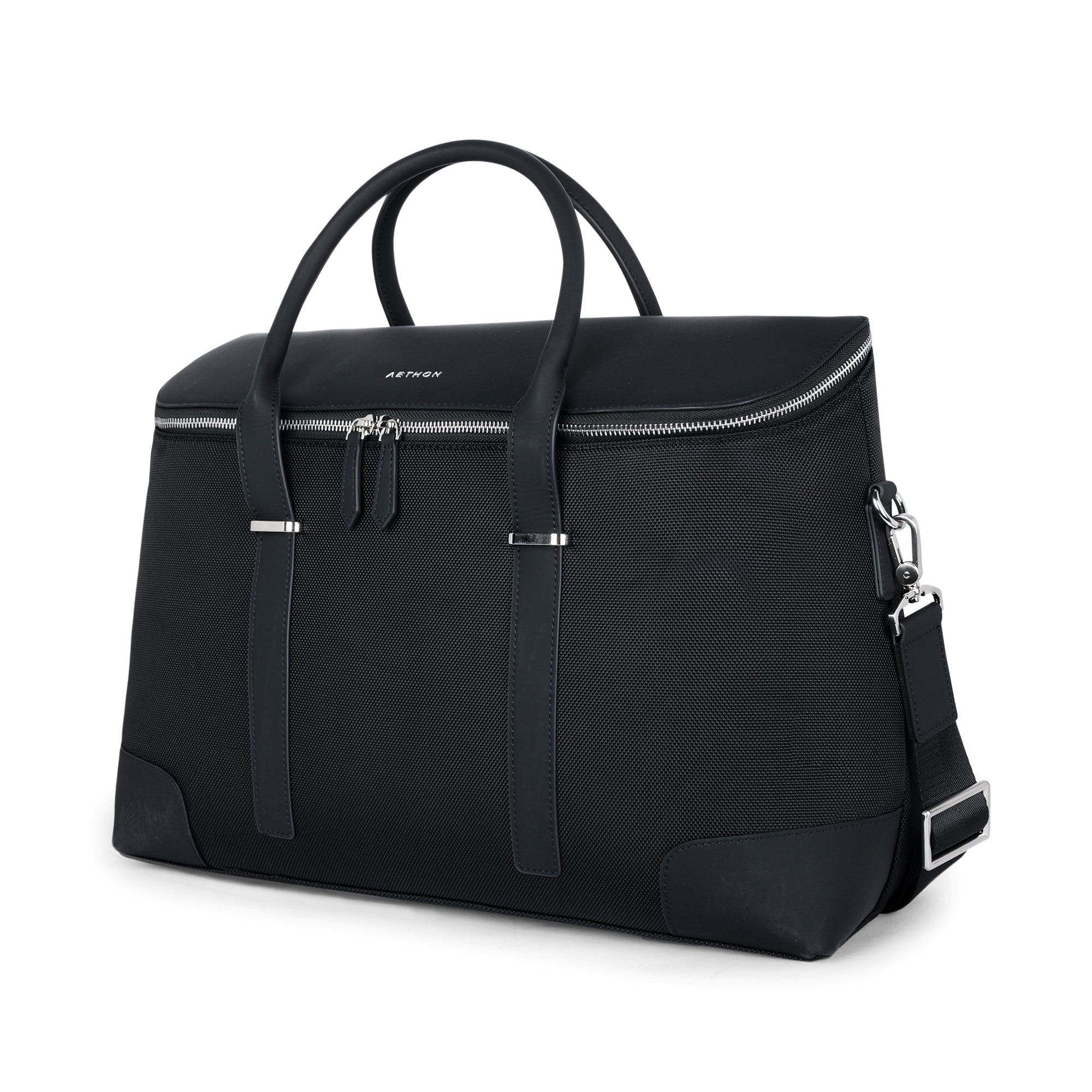 Stylera black fabric duffle with leather trim double handles top zip and detachable shoulder strap stylish travel duffle bag