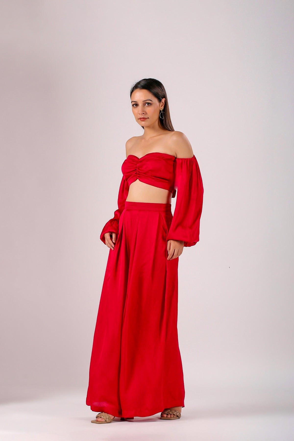 Chic red off-the-shoulder matching set for women featuring a crop top and flowy pants, stylish trendy matching sets for women
