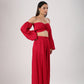 Trendy matching sets for women in red featuring a crop top with puff sleeves and wide-leg pants