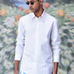 Stylish white shirt for men by Stylera worn with blue patterned pants