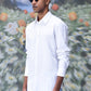 Stylish white shirt for men by Stylera worn with blue striped pants