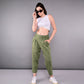 Fashionable model wearing stylish yoga pants with pockets in olive green and a white crop top