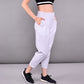 Light grey stylish yoga pants with pockets designed for comfort and flexibility during workouts