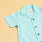 Light green and white summer gingham romper outfit with short sleeves and button details