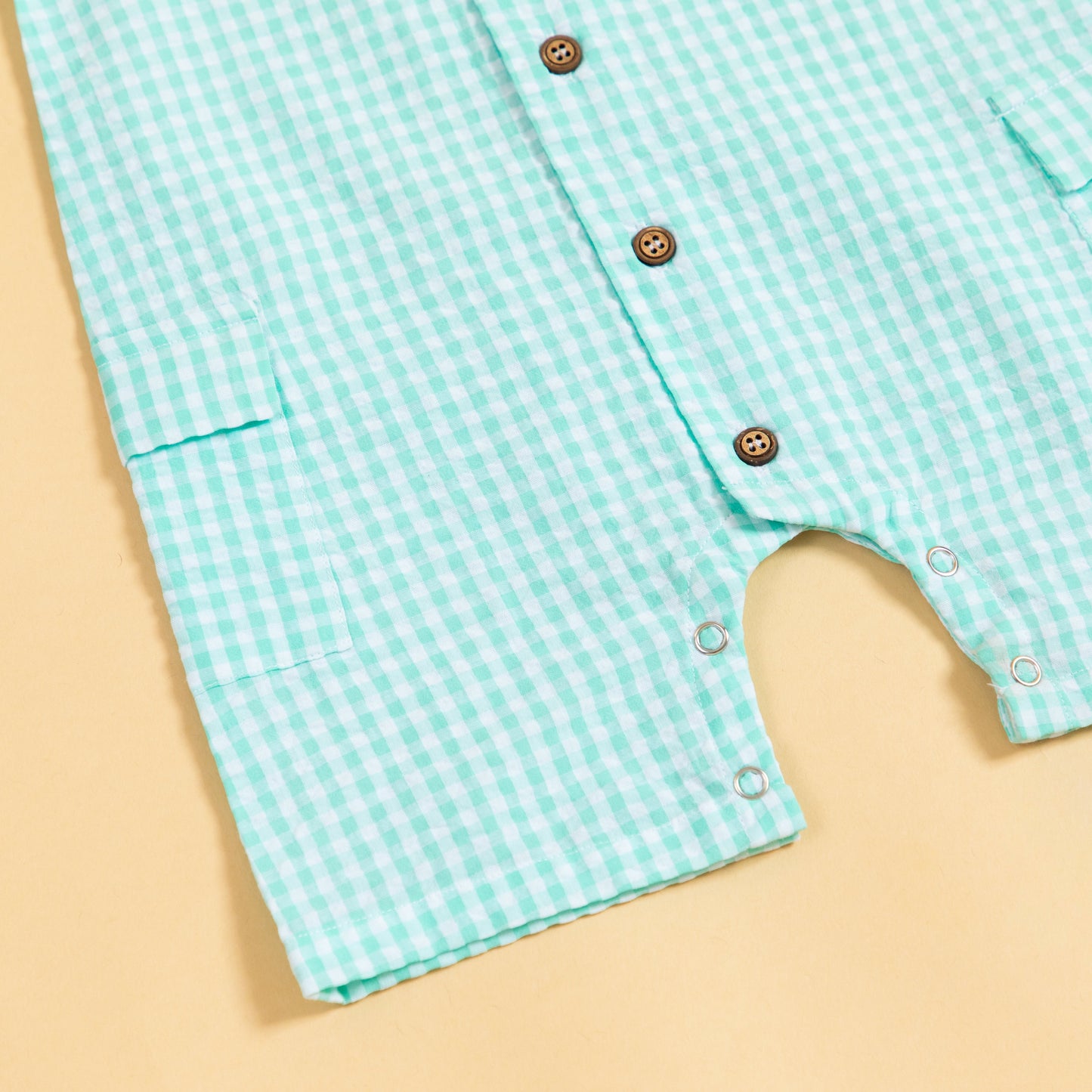 Stylera summer gingham romper outfit in turquoise with button details and pockets for kids