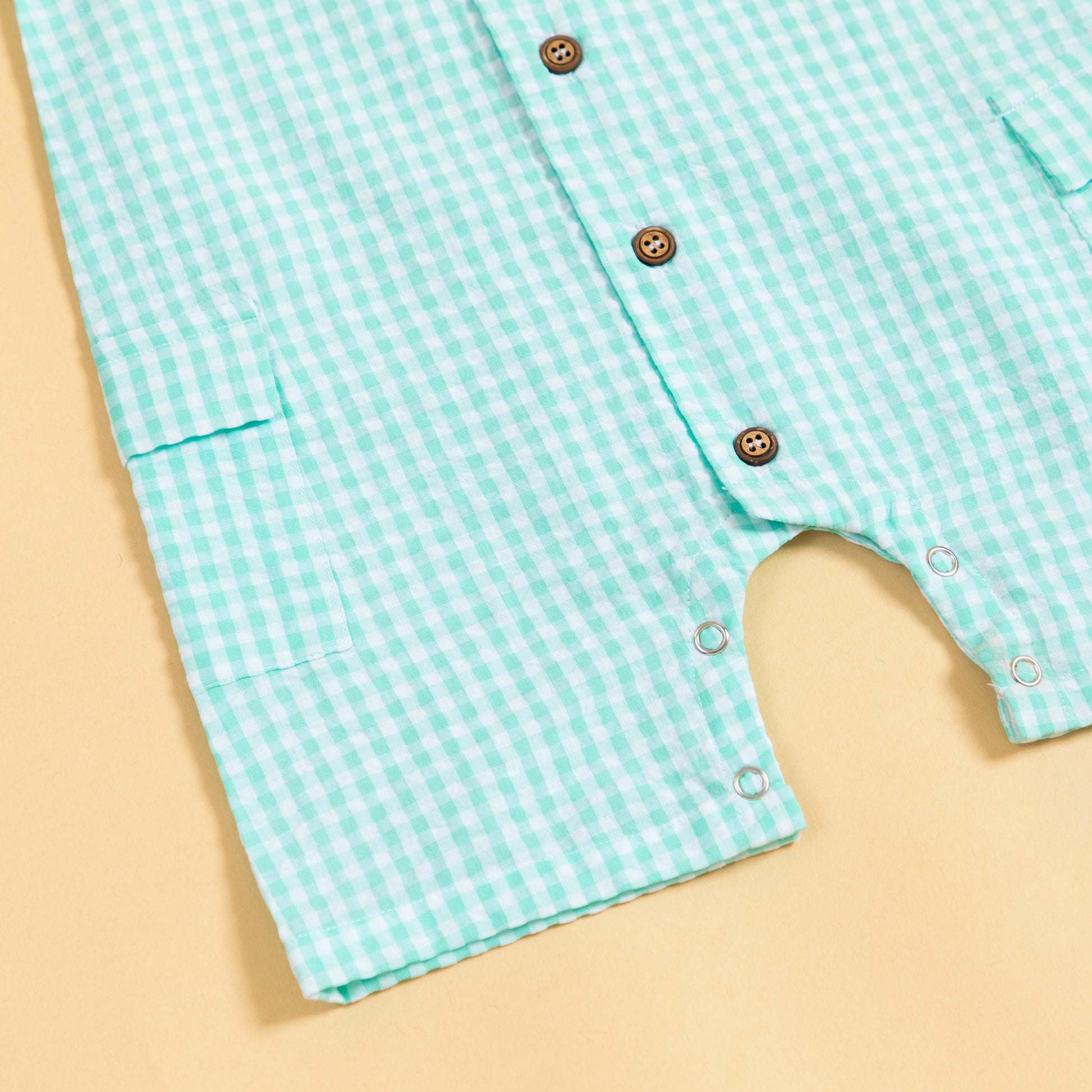 Stylera summer gingham romper outfit in turquoise with button details and pockets for kids