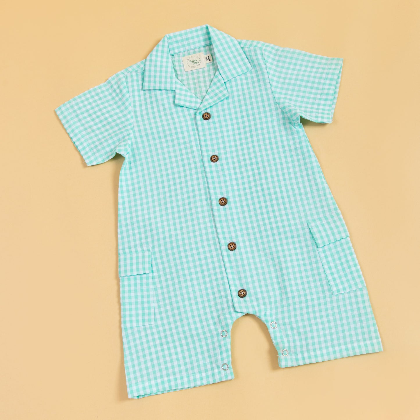 Stylera summer gingham romper outfit in light blue with short sleeves and button details