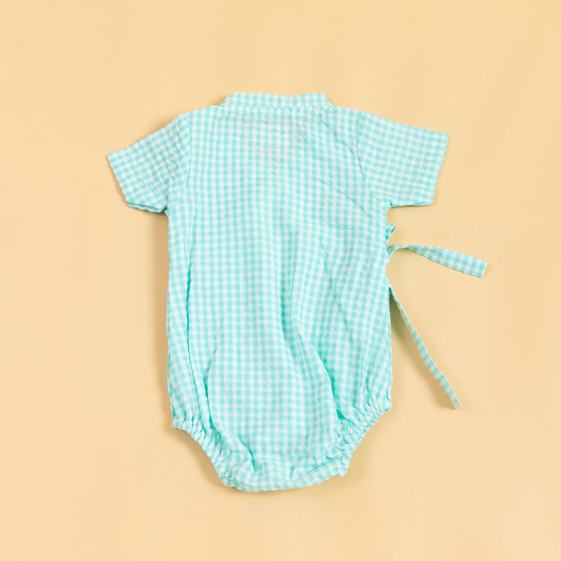 Light blue checkered summer kimono romper for infants with short sleeves and tie details