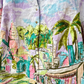 colorful long sleeve art shirt with pastel tropical cityscape print palm trees and visible front buttons