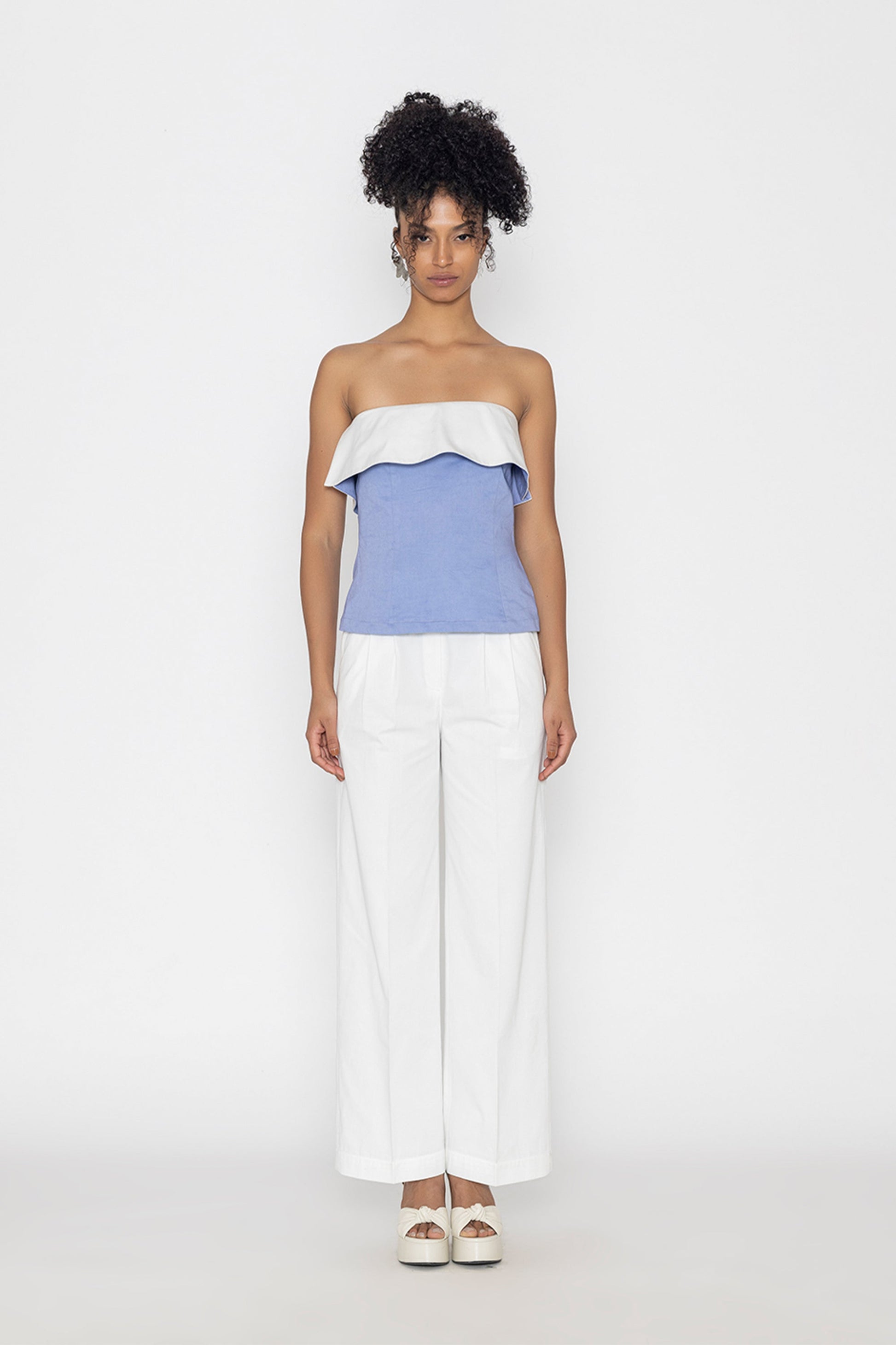 Swan lake inspired fashion top in blue and white strapless design paired with white wide-leg pants