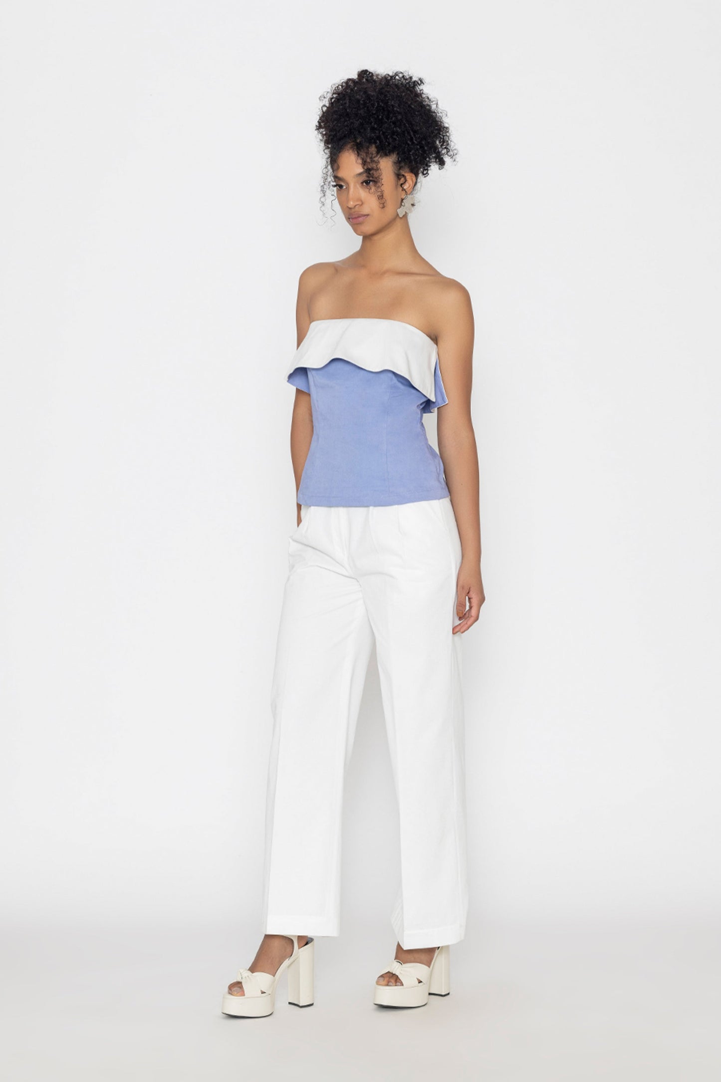 Stylera Swan lake inspired fashion top in blue and white strapless style worn with white pants