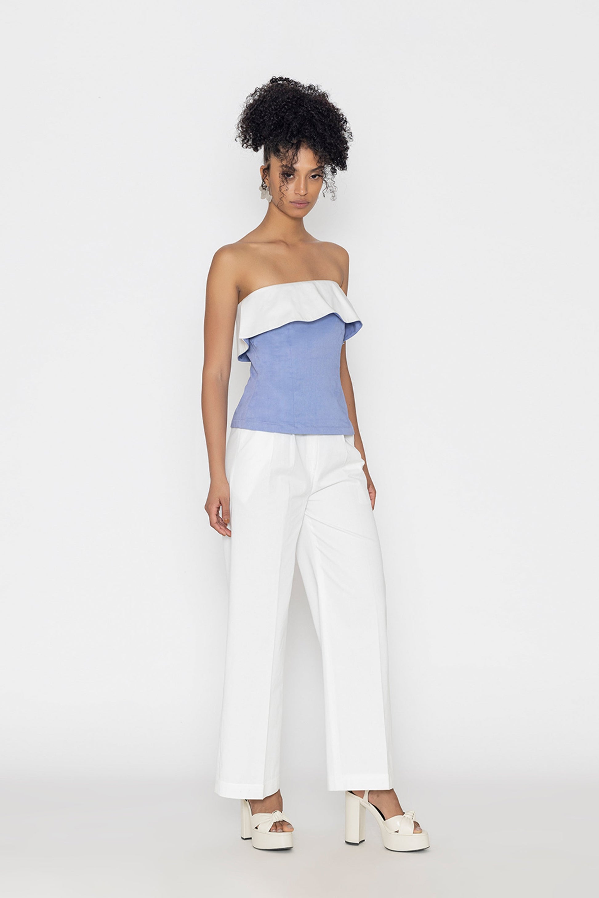 Stylera Swan lake inspired fashion top in blue and white worn with white pants