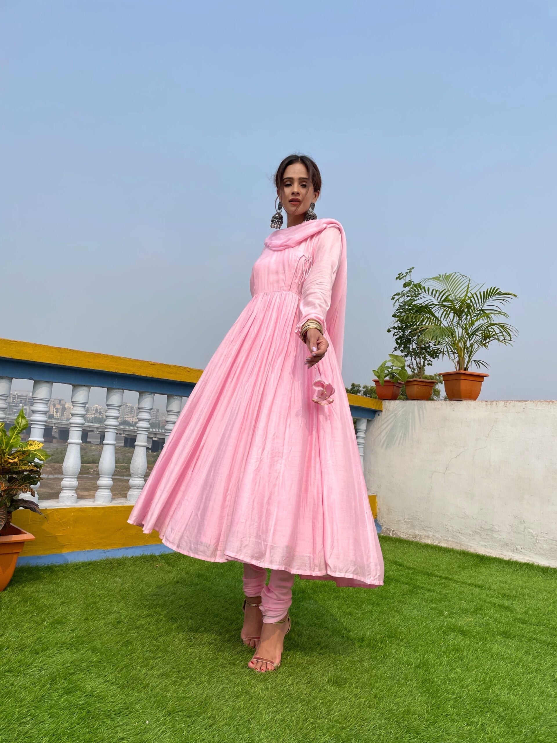 Elegant taffy pink anarkali suit set with flared silhouette and matching dupatta for festive occasions