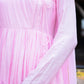 Close-up of a taffy pink anarkali suit set showcasing pleated design and elegant detailing