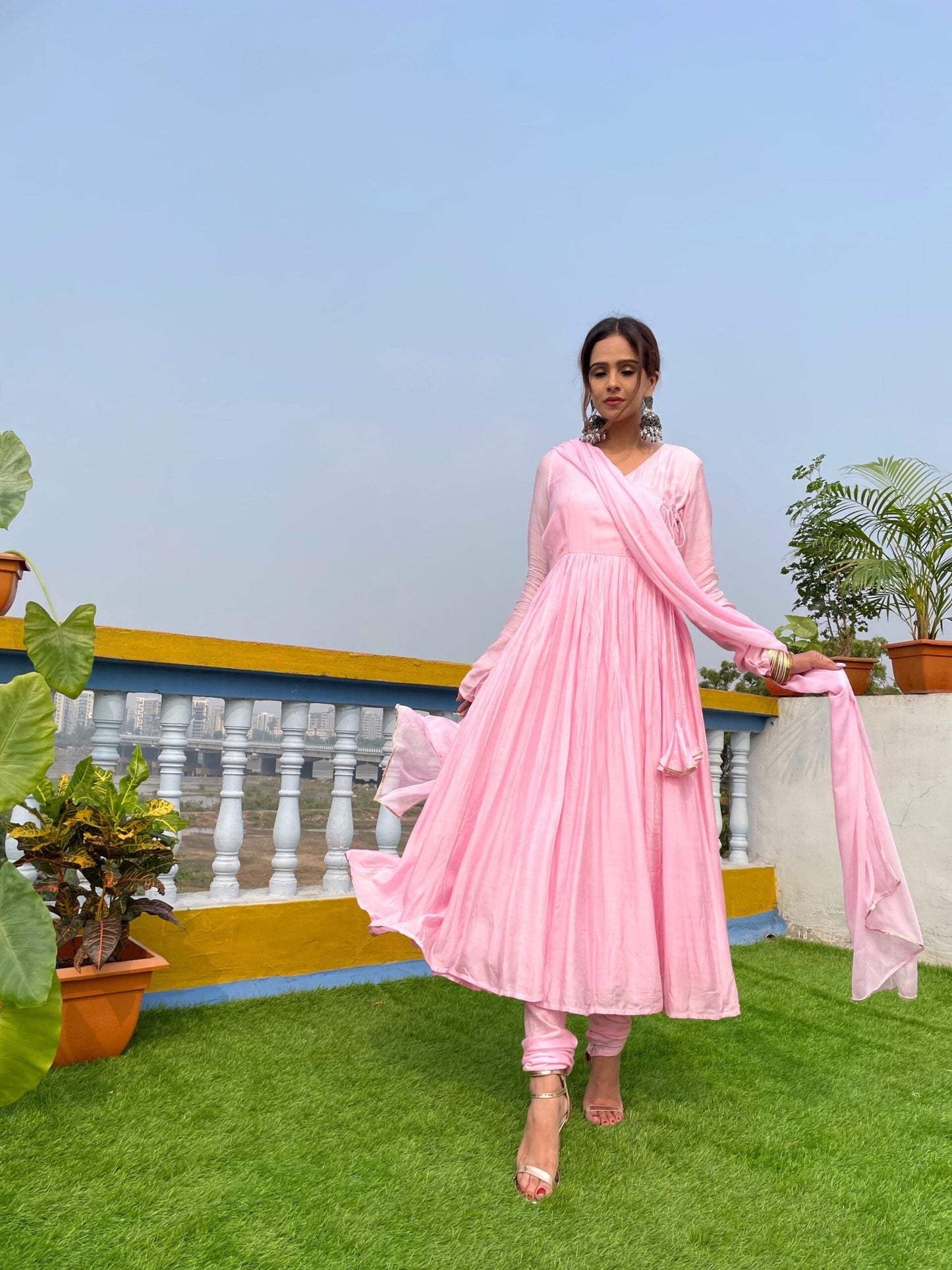 Elegant taffy pink anarkali suit set with intricate design, perfect for festive occasions